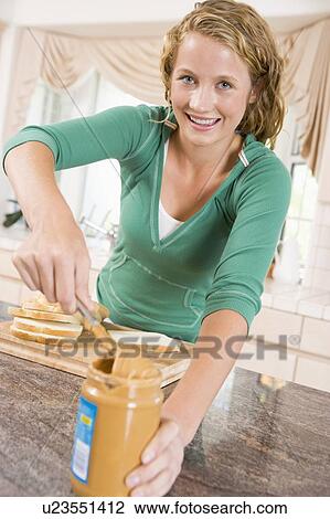Teenage Girl Making Peanut Butter Sandwich View Large Photo Image Stock Image - Teenage Girl Making Peanut Butter Sandwich. Fotosearch