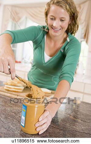 Teenage Girl Making Peanut Butter Sandwich View Large Photo Image Stock Photography - Teenage Girl Making Peanut Butter Sandwich. Fotosearch