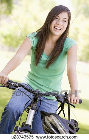 Stock Photography - Teenage Girl On Bicycle. Fotosearch