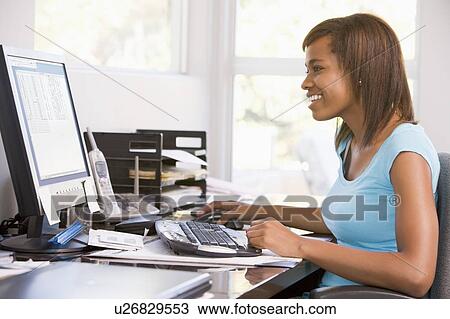 Stock Image - Teenage Girl Using Desktop Computer . Fotosearch