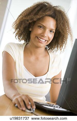 Stock Photo - Teenage Girl Using Desktop Computer . Fotosearch