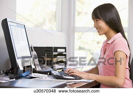 Stock Photo - Teenage Girl Using Desktop Computer . Fotosearch