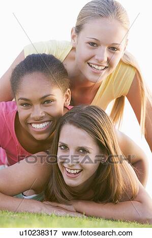 Teenage Girls Having Fun Outdoors View Large Photo Image Stock Photo - Teenage Girls Having Fun Outdoors . Fotosearch