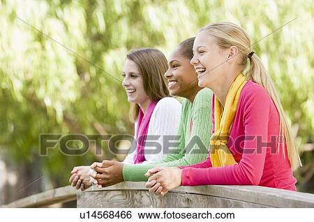 Teenage Girls Leaning On Wooden Railing View Large Photo Image Stock Photograph - Teenage Girls Leaning On Wooden Railing. Fotosearch