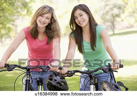 Teenage Girls On Bicycles View Large Photo Image Stock Photo - Teenage Girls On Bicycles. Fotosearch