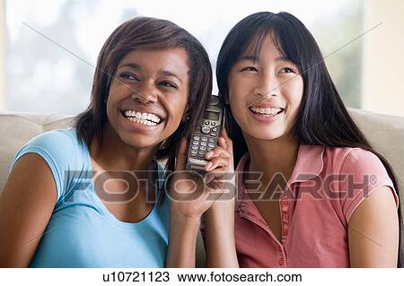 Teenage Girls Talking On Telephone View Large Photo Image Stock Image - Teenage Girls Talking On Telephone . Fotosearch