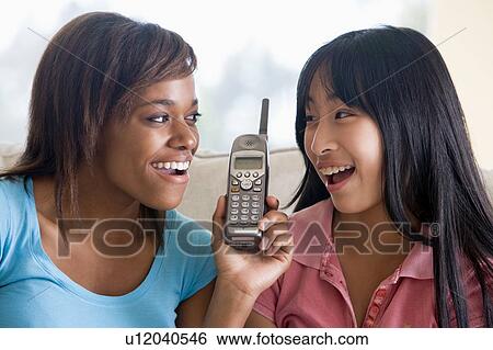 Teenage Girls Talking On Telephone View Large Photo Image Stock Photograph - Teenage Girls Talking On Telephone . Fotosearch