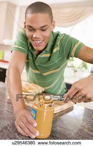 Teenage Male Making Peanut Butter Sandwich View Large Photo Image Stock Image - Teenage Male Making Peanut Butter Sandwich. Fotosearch