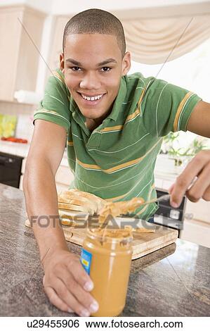 Teenage Male Making Peanut Butter Sandwich View Large Photo Image Stock Photograph - Teenage Male Making Peanut Butter Sandwich. Fotosearch
