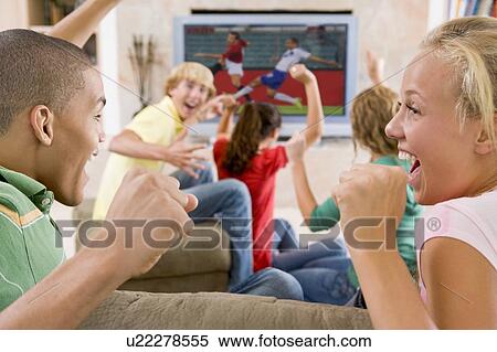 Teenagers Hanging Out In Front Of Television View Large Photo Image Stock Photography - Teenagers Hanging Out In Front Of Television . Fotosearch