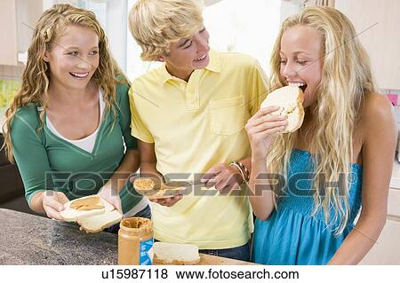 Stock Photo - Teenagers Making Sandwiches. Fotosearch
