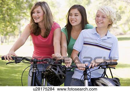 Teenagers On Bicycles View Large Photo Image Picture - Teenagers On Bicycles . Fotosearch