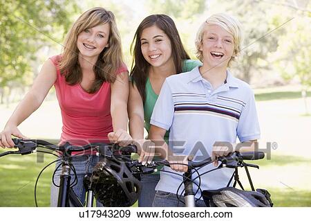 Teenagers On Bicycles View Large Photo Image Stock Photo - Teenagers On Bicycles . Fotosearch