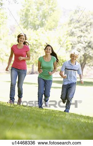Teenagers Running Through Park View Large Photo Image Stock Photograph - Teenagers Running Through Park. Fotosearch