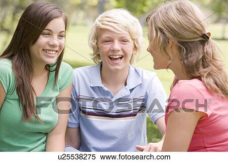Teenagers Sitting And Conversing View Large Photo Image Stock Photography - Teenagers Sitting And Conversing. Fotosearch