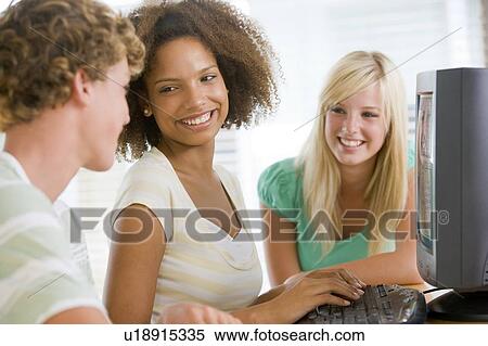 Teenagers Using Desktop Computer Together View Large Photo Image Stock Photography - Teenagers Using Desktop Computer Together. Fotosearch