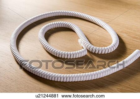 Stock Image - Telephone Cord Making 'At' Symbol. Fotosearch