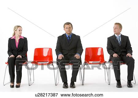 Three Business People Sitting On Red Plastic Seats View Large Photo Image Stock Photo - Three Business People Sitting On Red Plastic Seats . Fotosearch