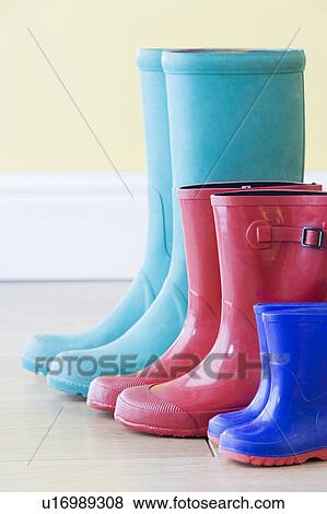 Three Pairs Of Colorful Gumboots In A Row View Large Photo Image Stock Photo - Three Pairs Of Colorful Gumboots In A Row. Fotosearch