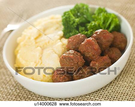 Tomato Meatballs with Parmesan Polenta and Broccoli View Large Photo Image Stock Photo - Tomato Meatballs with Parmesan Polenta and Broccoli. Fotosearch