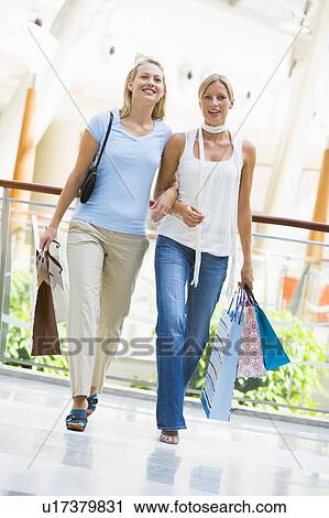 Two women at a shopping mall View Large Photo Image Stock Image - Two women at a shopping mall. Fotosearch