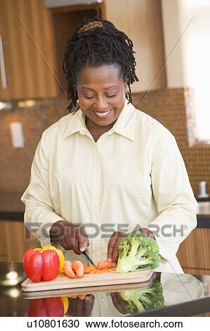 Woman Chopping Vegetables View Large Photo Image Stock Image - Woman Chopping Vegetables. Fotosearch