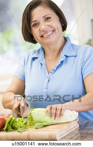 Woman Chopping Vegetables View Large Photo Image Stock Image - Woman Chopping Vegetables. Fotosearch