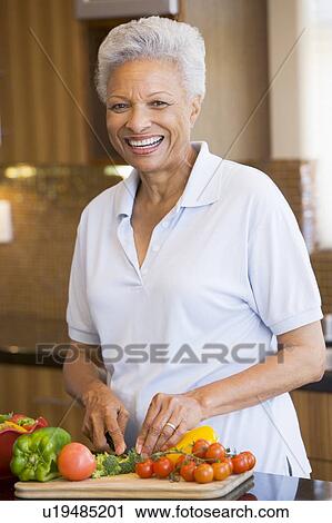 Woman Chopping Vegetables View Large Photo Image Stock Image - Woman Chopping Vegetables. Fotosearch