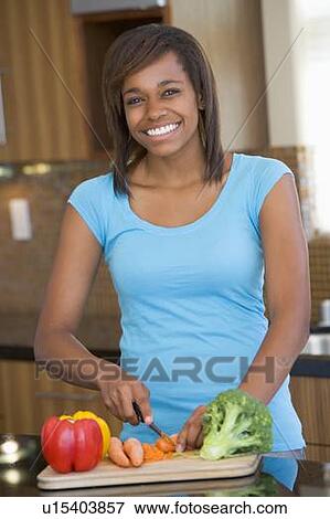 Woman Chopping Vegetables View Large Photo Image Stock Photo - Woman Chopping Vegetables. Fotosearch