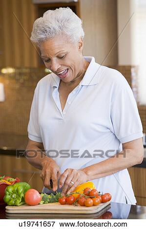Woman Chopping Vegetables View Large Photo Image Stock Photo - Woman Chopping Vegetables. Fotosearch