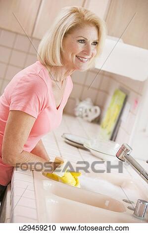 Woman Cleaning Kitchen Counter View Large Photo Image Stock Image - Woman Cleaning Kitchen Counter. Fotosearch