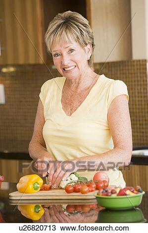Woman Cutting Up Vegetables View Large Photo Image Stock Image - Woman Cutting Up Vegetables. Fotosearch