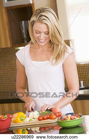 Woman Cutting Vegetables View Large Photo Image Stock Photo - Woman Cutting Vegetables. Fotosearch
