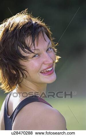 Woman exercising in park View Large Photo Image Stock Photo - Woman exercising in park. Fotosearch