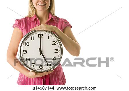 Picture - Woman Holding Clock. Fotosearch