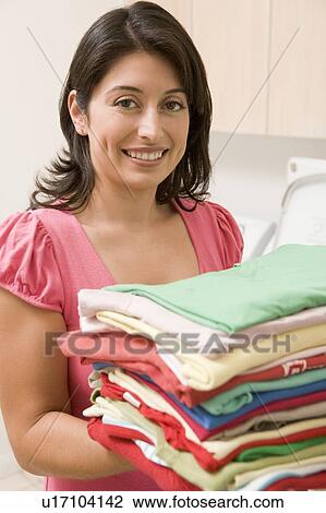 Woman Holding Fresh Laundry View Large Photo Image Stock Image - Woman Holding Fresh Laundry. Fotosearch