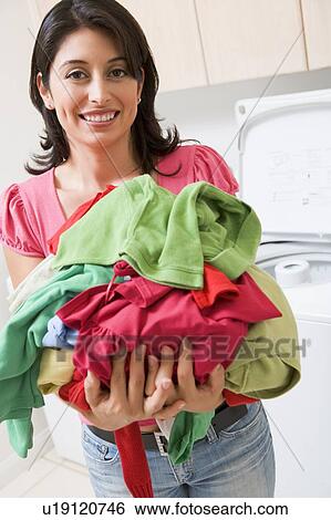 Woman Holding Pile Of Laundry View Large Photo Image Stock Photograph - Woman Holding Pile Of Laundry. Fotosearch