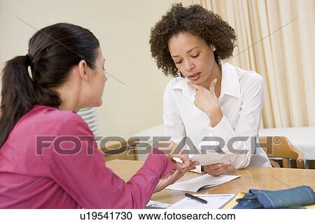 Woman in doctor's office frowning View Large Photo Image Stock Image - Woman in doctor's office frowning. Fotosearch
