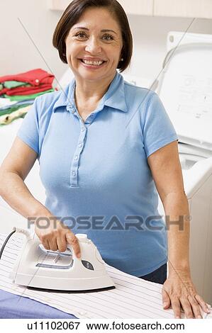 Stock Photo - Woman Ironing Shirt. Fotosearch