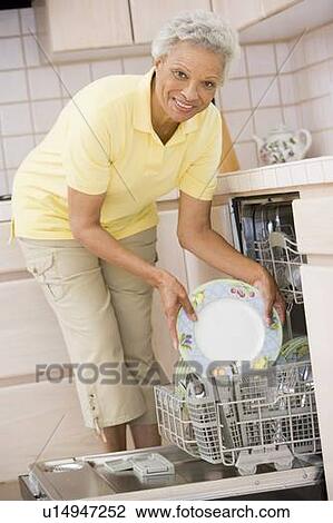 Woman Loading Dishwasher View Large Photo Image Stock Image - Woman Loading Dishwasher . Fotosearch