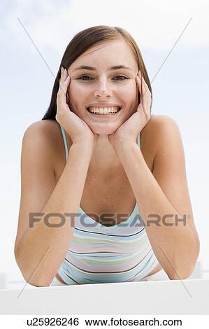 Stock Photograph - Woman posing outdoors. Fotosearch