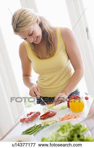 Stock Photo - Woman Preparing meal, mealtime, . Fotosearch