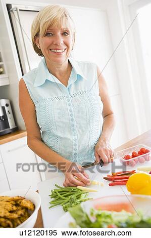 Stock Photography - Woman Preparing meal, mealtime . Fotosearch