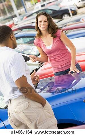 Picture - Woman shopping for a new car. Fotosearch
