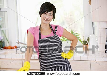 Stock Photograph - Woman Wearing Rubber Gloves. Fotosearch