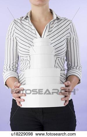 Stock Photo - Woman With Round Boxes. Fotosearch