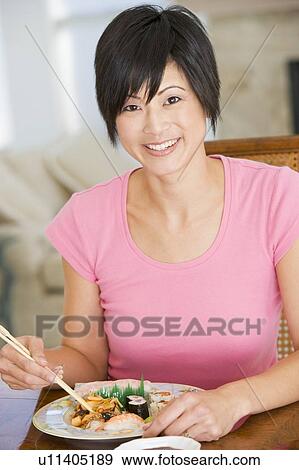 Women Eating meal, mealtime With Chopsticks View Large Photo Image Stock Photo - Women Eating meal, mealtime With Chopsticks . Fotosearch