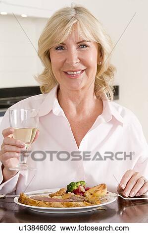 Women Enjoying meal, mealtime With A Glass Of Wine View Large Photo Image Stock Image - Women Enjoying meal, mealtime With A Glass Of Wine . Fotosearch