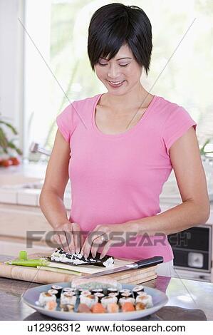 Women Preparing Sushi Rolls View Large Photo Image Stock Image - Women Preparing Sushi Rolls. Fotosearch