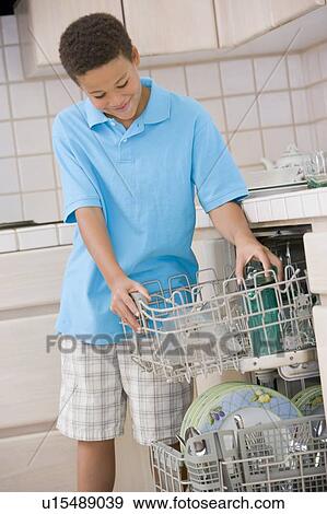 Young Boy Loading Dishwasher View Large Photo Image Stock Photo - Young Boy Loading Dishwasher. Fotosearch
